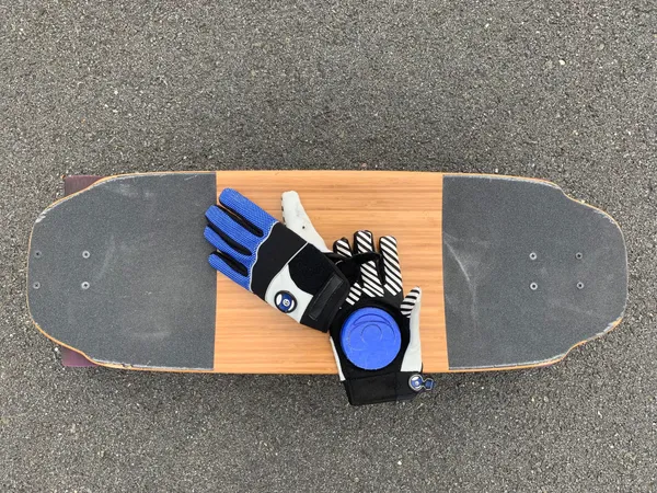 Board with riding gloves and the remote.