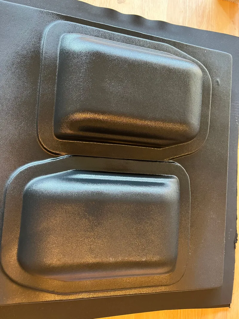 Two shells formed from one sheet, before trimming.