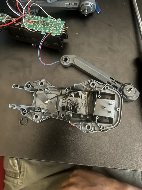 Frame and arms partly taken apart.