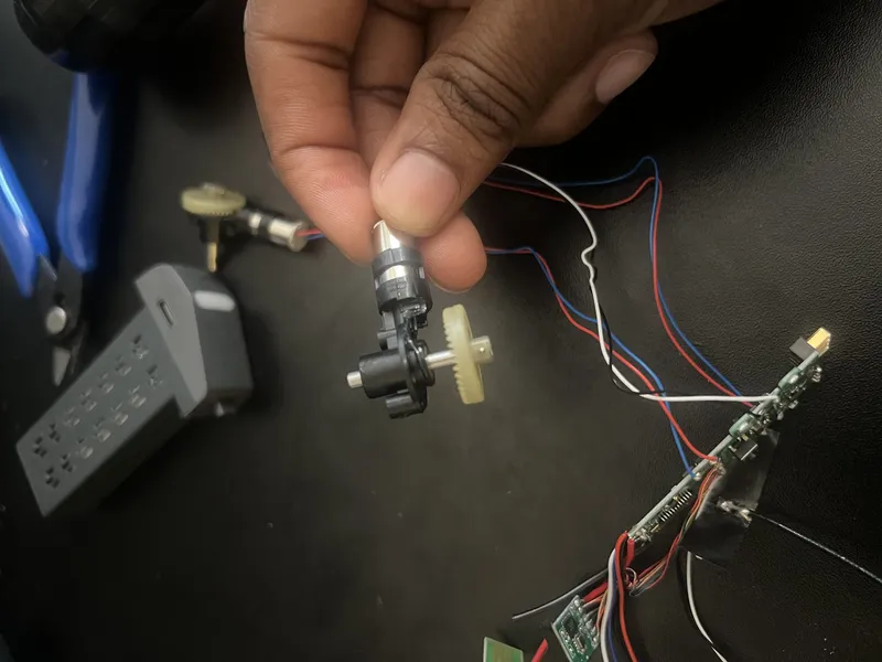 Motor and gear pulled from one of the arms.