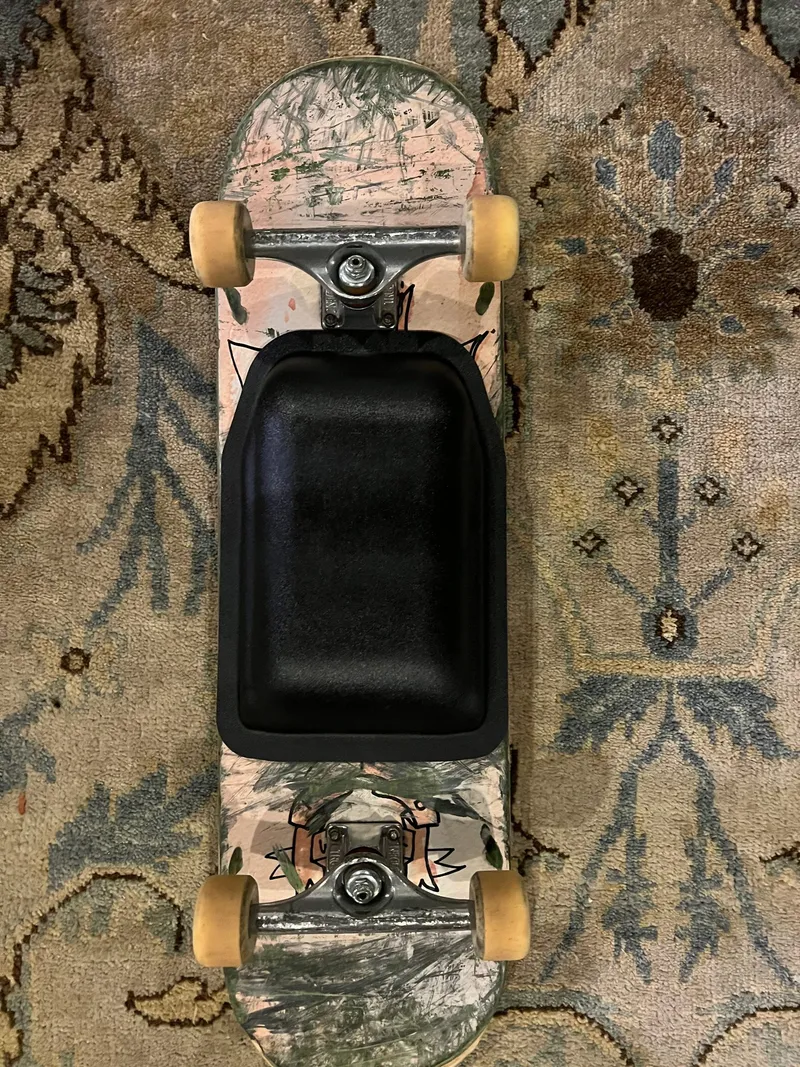 Mounted on a narrower skateboard deck.